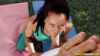 Kira Noir sucks cock and licks balls in the park